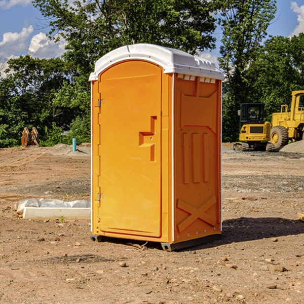 what is the cost difference between standard and deluxe portable restroom rentals in Liberty